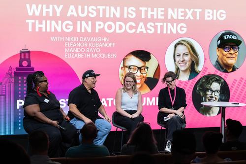 A Black woman with glasses and red earrings (Nikki DaVaughn), Latino man with a hat (Mando Rayo), white woman with glasses and blonde hair (Eleanor Klibanoff) and a white woman with glasses and short hair (Elizabeth McQueen) sit on a panel in front of a projection of their names and images